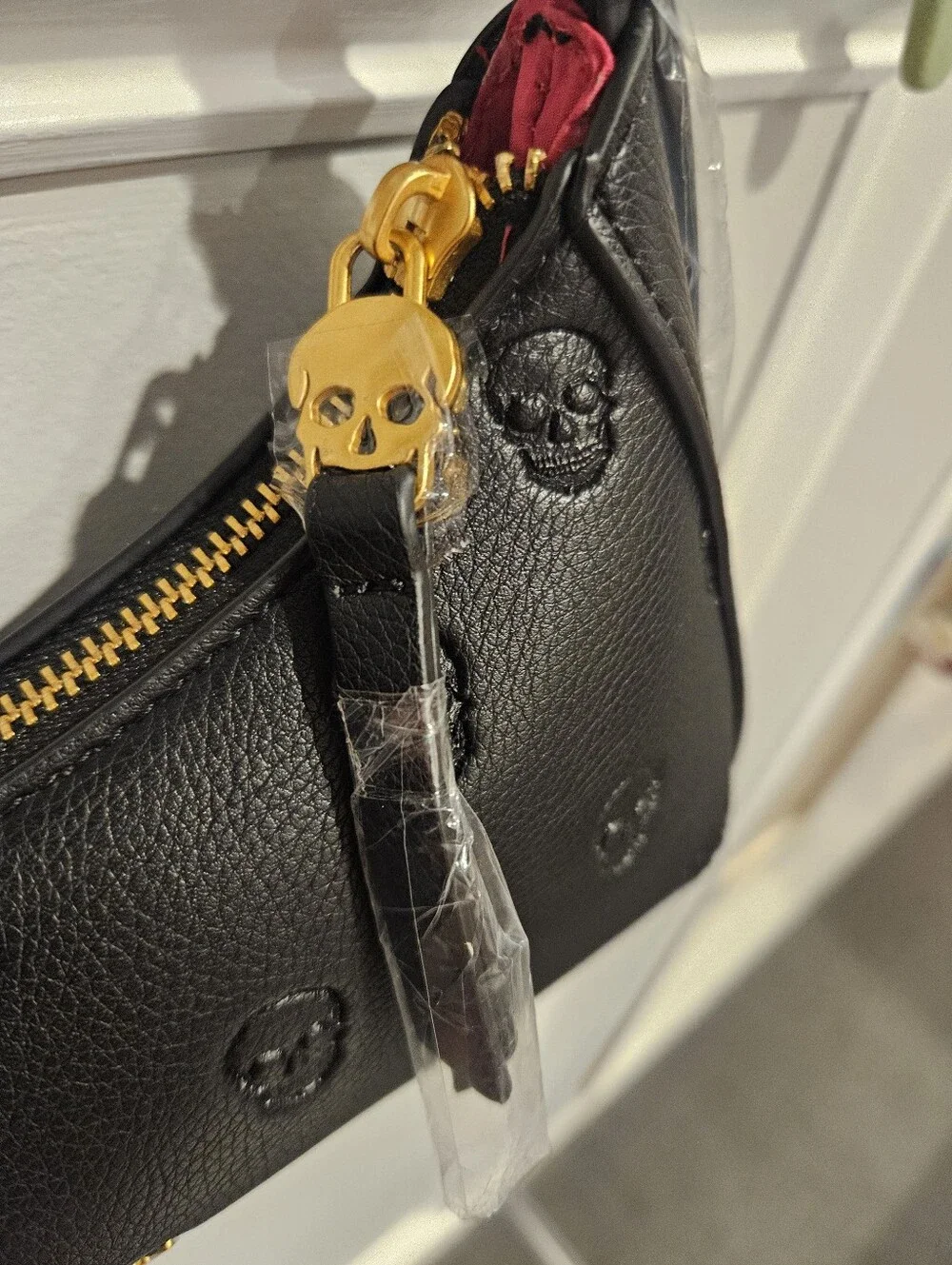 Betsey Johnson Black Leather Shoulder Bag with Skull Emboss and Scarf Accent